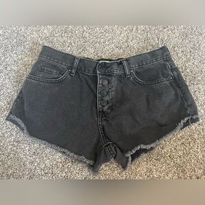 Black jean shorts, distressed, and high waisted.